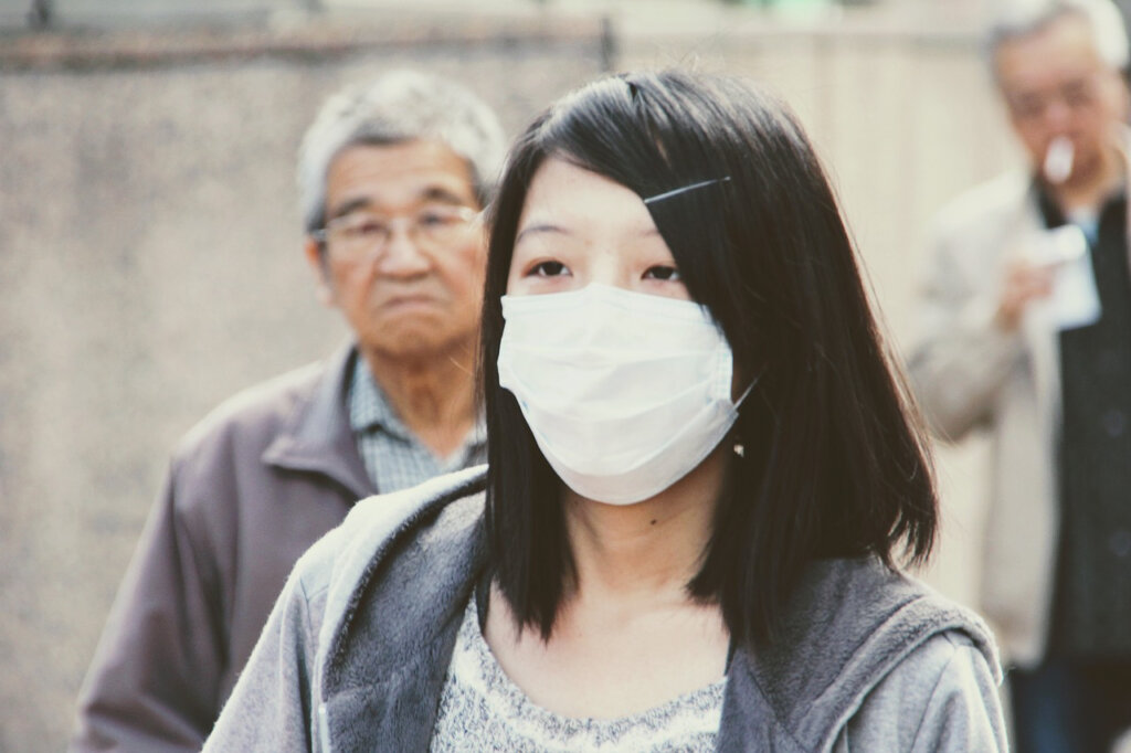 the women wearing mask because protect herself from Coronavirus